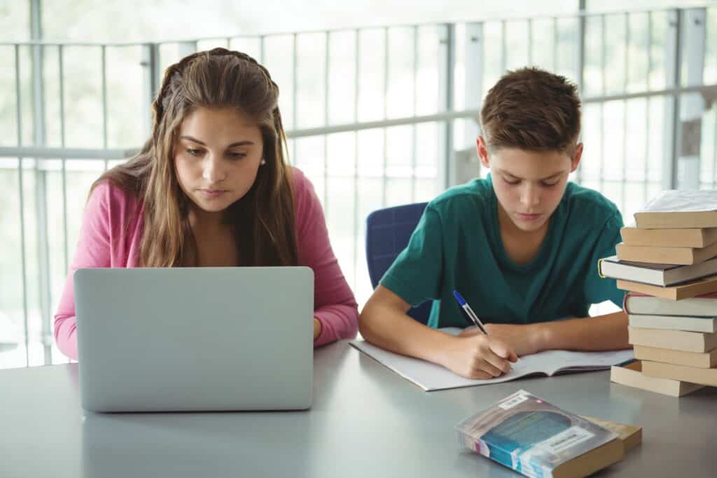 School kids doing their homework in the library