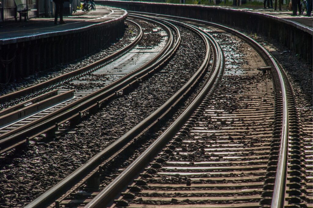 Empty rail tracks in the concept of 'How to use Richmond's public transport'.