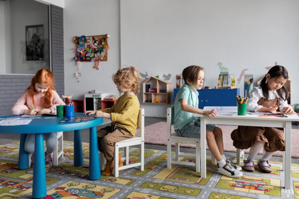 Young students doing artwork in a class